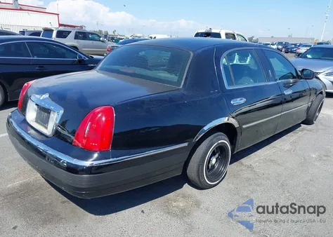 2001 Lincoln Town Car Executive из США, поврежденный, VIN 1LNHM84W11Y632590